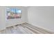 Clean bedroom with new flooring, a large window and neutral walls at 835 N Dearborn St, Indianapolis, IN 46201