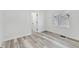 Bright bedroom featuring new flooring and a window with blinds at 835 N Dearborn St, Indianapolis, IN 46201