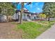 Charming house exterior showing a lovely front yard and porch, perfect for enjoying neighborhood views at 835 N Dearborn St, Indianapolis, IN 46201