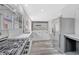 Spacious kitchen featuring stainless appliances, stone countertops and gray floors at 835 N Dearborn St, Indianapolis, IN 46201