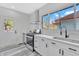 Modern kitchen featuring stainless steel appliances, white cabinetry, and a bright window at 835 N Dearborn St, Indianapolis, IN 46201
