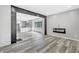 Spacious living room showcasing open layout, modern flooring, and a decorative fireplace at 835 N Dearborn St, Indianapolis, IN 46201