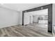 Open-concept living area with sleek floors, neutral walls, and seamless flow to the kitchen at 835 N Dearborn St, Indianapolis, IN 46201