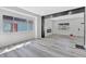 Bright living room featuring modern flooring, fresh paint, and plenty of natural light at 835 N Dearborn St, Indianapolis, IN 46201
