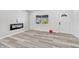 Bright living room featuring modern flooring, fresh paint, and plenty of natural light at 835 N Dearborn St, Indianapolis, IN 46201