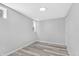 Light-filled room with a modern gray palette and stylish wood-look laminate flooring at 835 N Dearborn St, Indianapolis, IN 46201