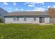 Backyard featuring a well-kept lawn and the house's back facade at 84 Beech Ct, Whiteland, IN 46184