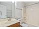 Clean bathroom featuring a shower-tub combo and a vanity with a marble countertop at 84 Beech Ct, Whiteland, IN 46184