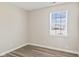 A bedroom featuring vinyl floors and a window for natural light at 84 Beech Ct, Whiteland, IN 46184
