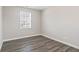 This bedroom has new vinyl floors and a window that provides natural light at 84 Beech Ct, Whiteland, IN 46184