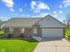 Charming single-story home features a brick facade and attached two-car garage at 84 Beech Ct, Whiteland, IN 46184
