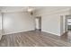 Spacious living room featuring hardwood-style floors and a ceiling fan at 84 Beech Ct, Whiteland, IN 46184