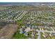 An expansive aerial perspective showcasing neighborhood layout, community spaces, and connectivity at 84 Beech Ct, Whiteland, IN 46184