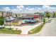 Aerial perspective of an inviting outdoor venue with colorful umbrellas, surrounded by lush greenery and convenient parking at 8740 Morgan Dr, Fishers, IN 46038
