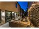 Inviting back patio with comfortable seating, ambient lighting, and sliding glass doors into the home at 8740 Morgan Dr, Fishers, IN 46038