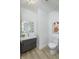 Powder room featuring a modern vanity and toilet with art at 8740 Morgan Dr, Fishers, IN 46038