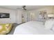Spacious bedroom featuring a ceiling fan, art, and a cozy seating area at 8740 Morgan Dr, Fishers, IN 46038
