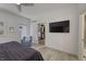 Bedroom with a view of the walk-in closet, a comfortable sitting chair and dark purple accents at 8740 Morgan Dr, Fishers, IN 46038