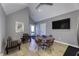 Bright dining area with vaulted ceilings, modern furnishings and a walkout to a covered porch at 8740 Morgan Dr, Fishers, IN 46038
