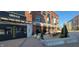 Exterior view of Cooper & Cow Steakhouse, featuring a modern brick building and outdoor seating at 8740 Morgan Dr, Fishers, IN 46038