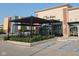 Exterior view of Tre Mori Pasta and Wine Bar with outdoor seating and well-maintained landscaping at 8740 Morgan Dr, Fishers, IN 46038