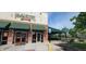 McAlister's Deli exterior featuring a brick facade, green awnings, and outdoor seating area at 8740 Morgan Dr, Fishers, IN 46038
