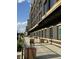 Enjoy the shaded sidewalk alongside Nickel Plate Hotel, with elegant planters and outdoor seating available at 8740 Morgan Dr, Fishers, IN 46038