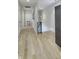 Hallway featuring hardwood floors, modern lighting, and a sleek design at 8740 Morgan Dr, Fishers, IN 46038