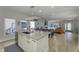 Bright and open kitchen layout with a modern island, stainless steel appliances, and hardwood floors at 8740 Morgan Dr, Fishers, IN 46038