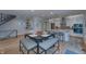 Open-concept kitchen and dining area with modern appliances and stylish lighting at 8740 Morgan Dr, Fishers, IN 46038