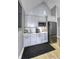 Modern kitchenette with gray cabinets, stainless steel appliances, and stylish backsplash at 8740 Morgan Dr, Fishers, IN 46038