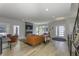Bright living room featuring a modern fireplace, entertainment center, and hardwood floors at 8740 Morgan Dr, Fishers, IN 46038