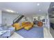 Spacious living area with an open floor plan, modern staircase, and view into the kitchen at 8740 Morgan Dr, Fishers, IN 46038