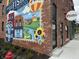 A colorful brick building mural welcomes you to Fishers, Indiana and advertises Barry Bagels at 8740 Morgan Dr, Fishers, IN 46038