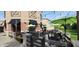 Lovely outdoor patio with ample seating, green umbrellas, and decorative floral arrangements at 8740 Morgan Dr, Fishers, IN 46038