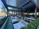 Outdoor patio offers dining with modern decor and comfortable seating arrangements at 8740 Morgan Dr, Fishers, IN 46038