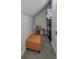 Playroom area with orange ottoman, toy kitchen, shelving for ample storage and ' play at 8740 Morgan Dr, Fishers, IN 46038
