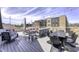 Relaxing roof deck featuring comfortable lounge seating, a dining table, and views of the surrounding neighborhood at 8740 Morgan Dr, Fishers, IN 46038