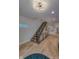 Modern staircase with wood steps, black metal railing, and light wood flooring in a contemporary home at 8740 Morgan Dr, Fishers, IN 46038