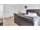 Bedroom featuring neutral carpet, side table and view to the entry door at 8813 Browns Valley Ln, Indianapolis, IN 46113