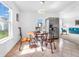 Bright kitchen dining area featuring a wooden table and a stainless steel refrigerator at 8813 Browns Valley Ln, Indianapolis, IN 46113