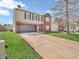 Two-story home with a two-car garage, manicured lawn, and brick and siding accents at 8813 Browns Valley Ln, Indianapolis, IN 46113