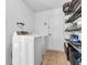 Functional laundry room with washer, dryer, and ample shelving for storage and organization at 8813 Browns Valley Ln, Indianapolis, IN 46113