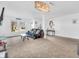 Bright and airy living room with large windows, carpet flooring, and stylish decor creating a welcoming space at 8813 Browns Valley Ln, Indianapolis, IN 46113