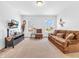 Comfortable living room with large windows, providing ample natural light and a cozy atmosphere at 8813 Browns Valley Ln, Indianapolis, IN 46113