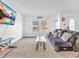 Inviting living room with carpet floors, featuring a comfortable sofa, coffee table, and natural light at 8813 Browns Valley Ln, Indianapolis, IN 46113