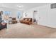 Spacious living room with plush furniture, offering a comfortable area for relaxation and entertainment at 8813 Browns Valley Ln, Indianapolis, IN 46113