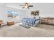 Serene main bedroom with ample natural light, offering a relaxing retreat with modern decor and comfort at 8813 Browns Valley Ln, Indianapolis, IN 46113