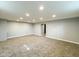 Finished basement featuring neutral carpet, gray walls, and recessed lighting at 9362 Helmsdale Dr, Indianapolis, IN 46256