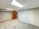 Finished basement with neutral carpet, gray walls, and a closet at 9362 Helmsdale Dr, Indianapolis, IN 46256